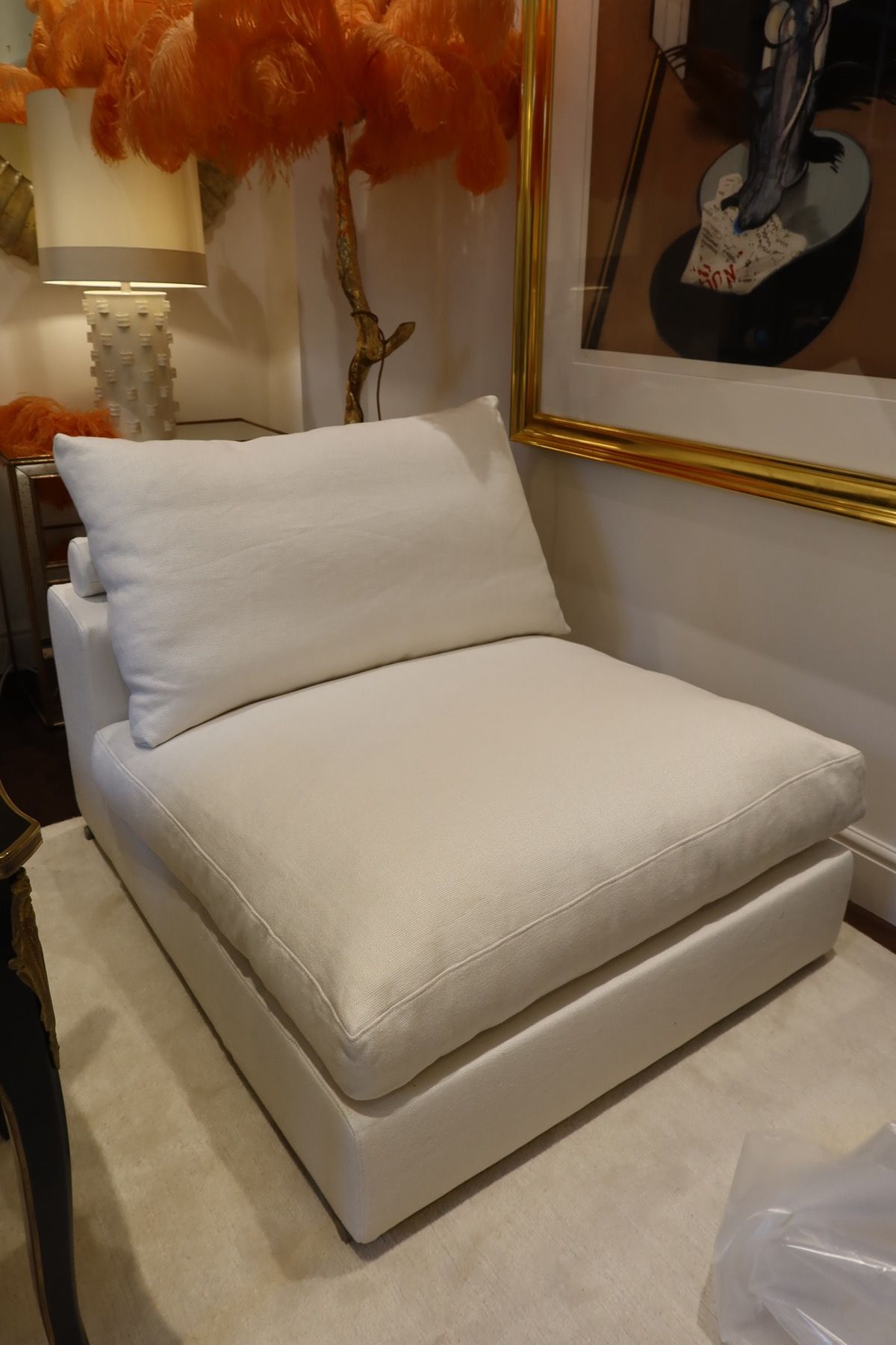 Custom upholstered cream armchair with fitted cushion and neat seams