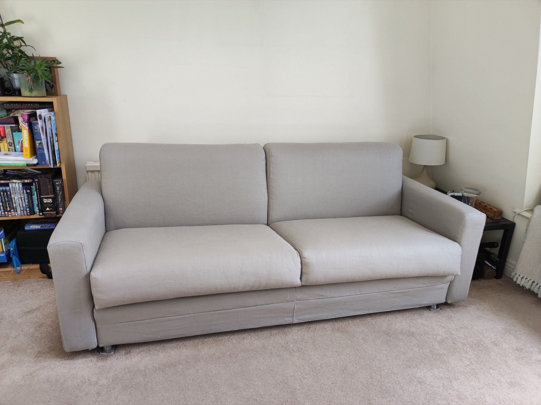 Light coloured sofa with a loose cover in a London home