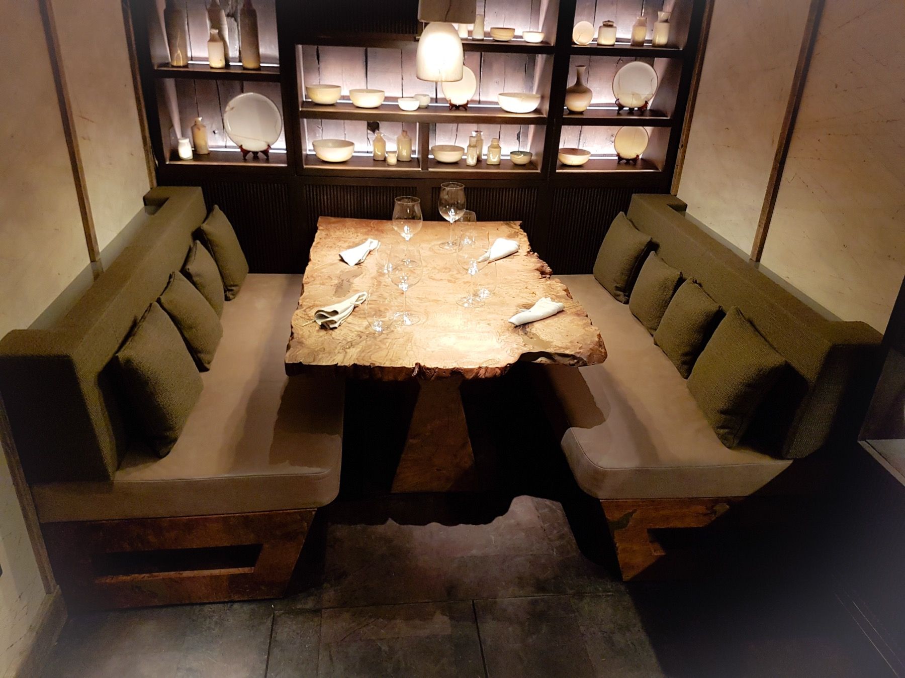 Commercial restaurant booth seating upholstered around a timber dining table
