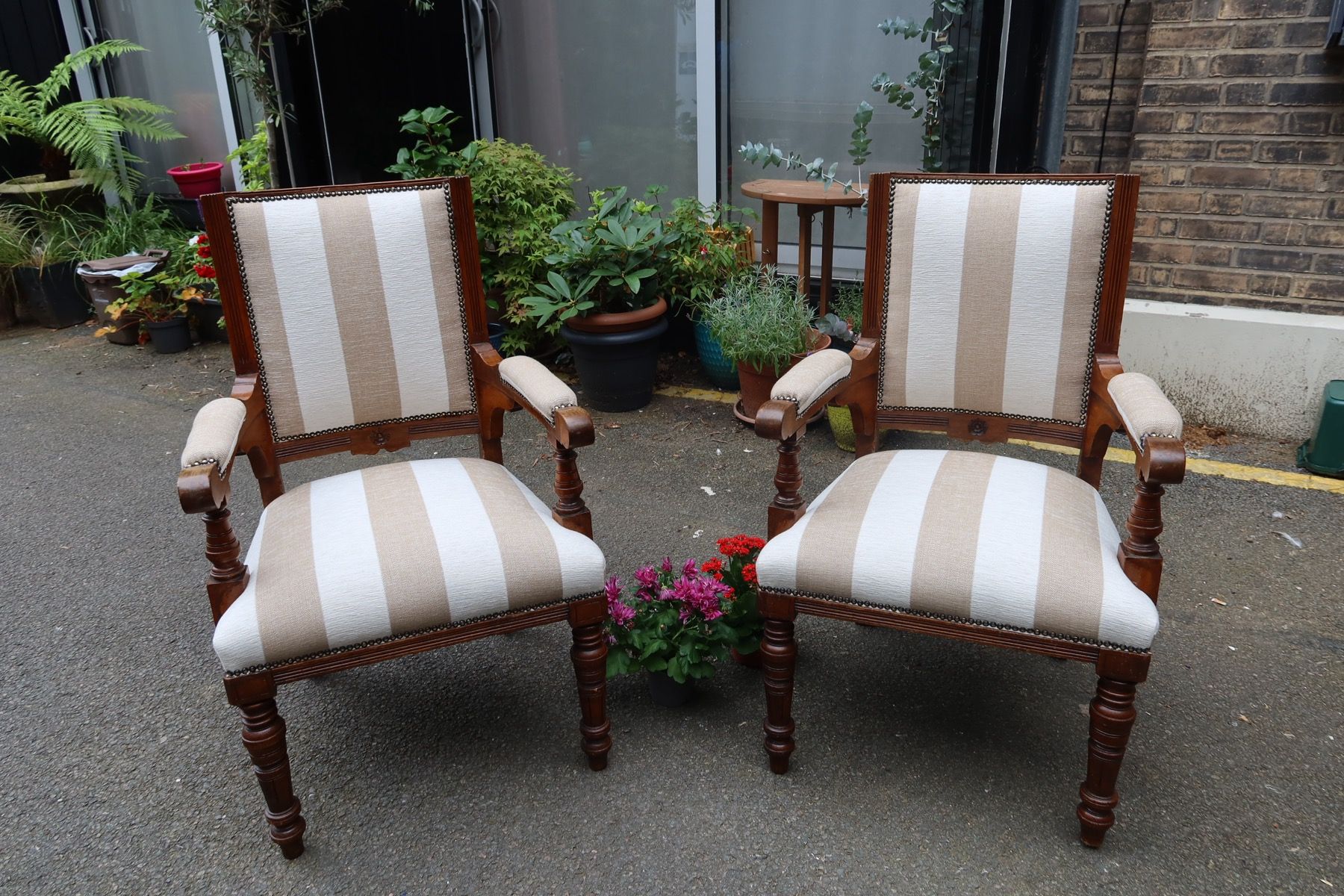 Pair of armchairs reupholstered in a striped natural-looking fabric